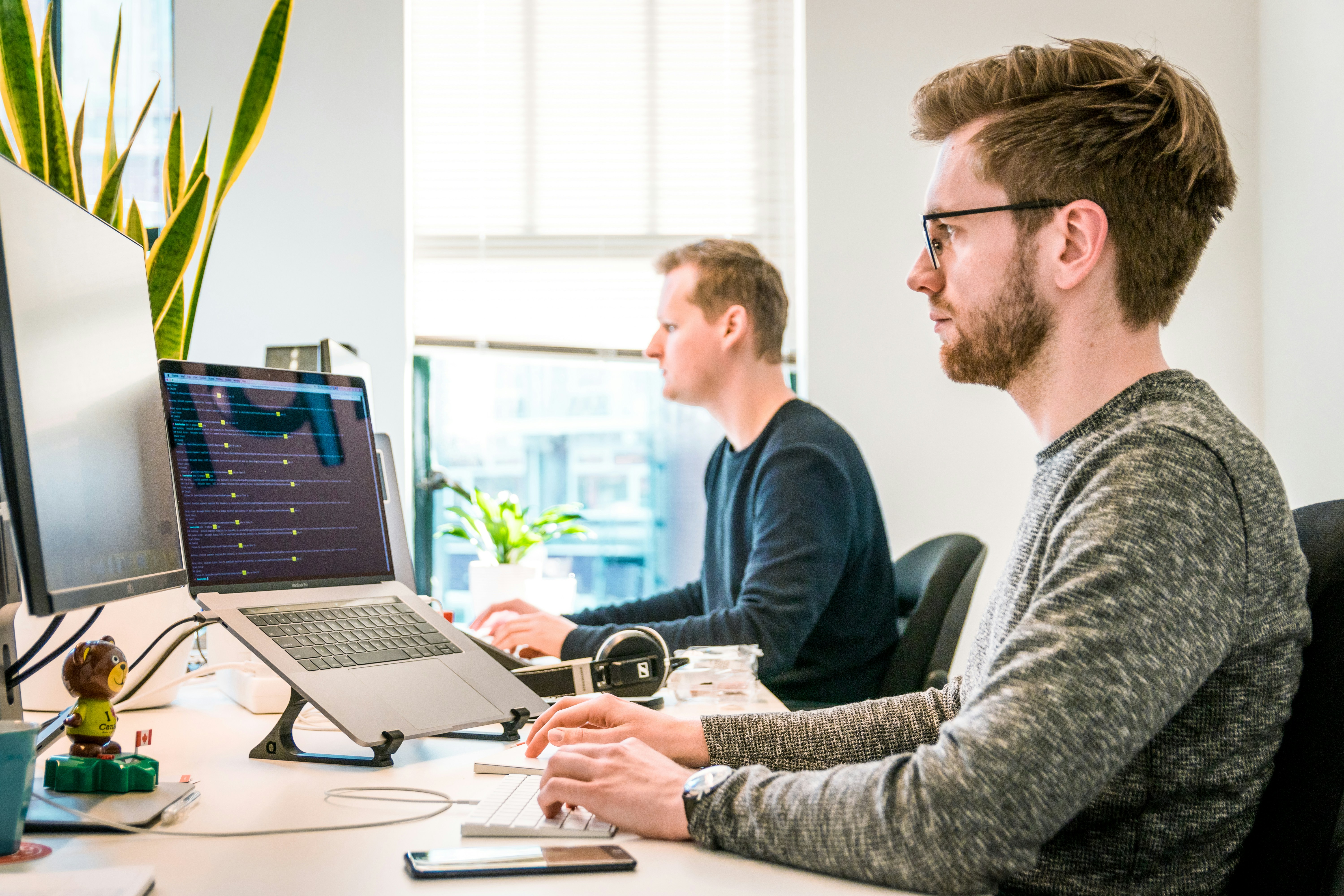 Two gentlemen doing work at an office
